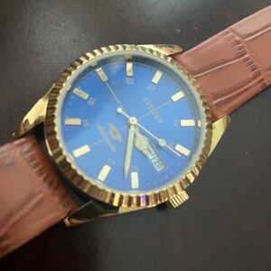 Citizen Gold Watch with Blue Dial and Tan Strap